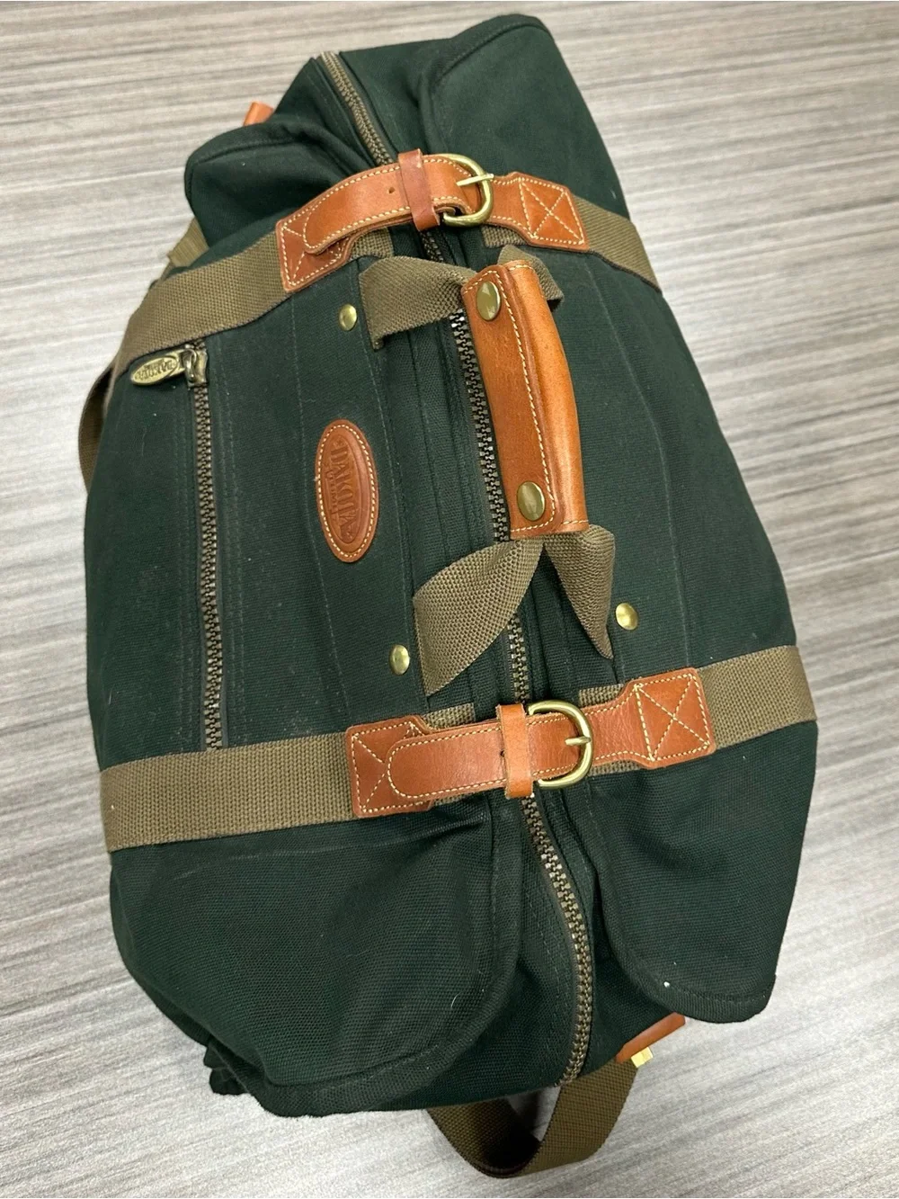 Tumi Dakota Dark Green Canvas Duffel with Tan Straps and Brown Leather Trim